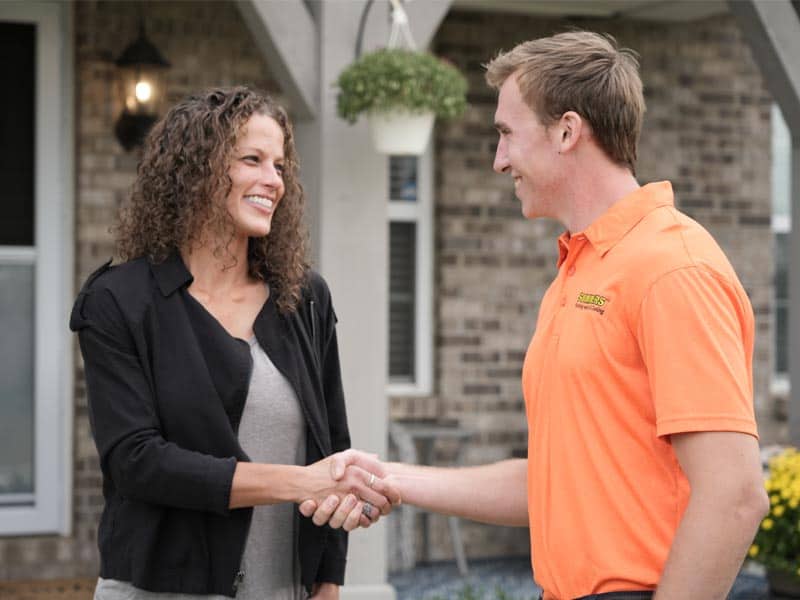 Summers PHC technician shaking hands with a Chesterton homeowner